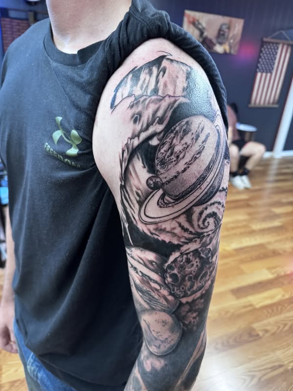 Black and gray celestial sleeve tattoo created at Flashover Ink