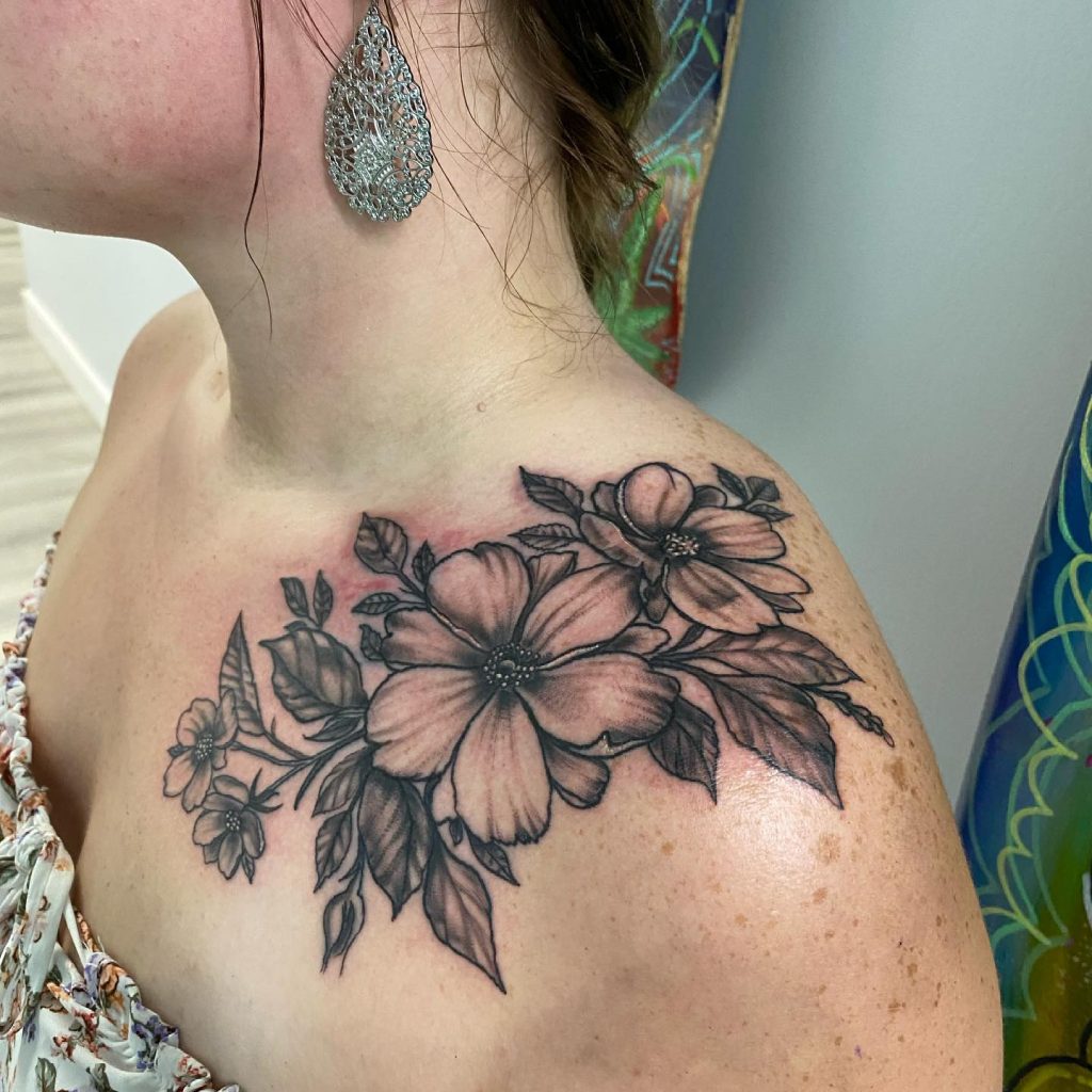 Tattoo on shoulder of a floral arrangement.